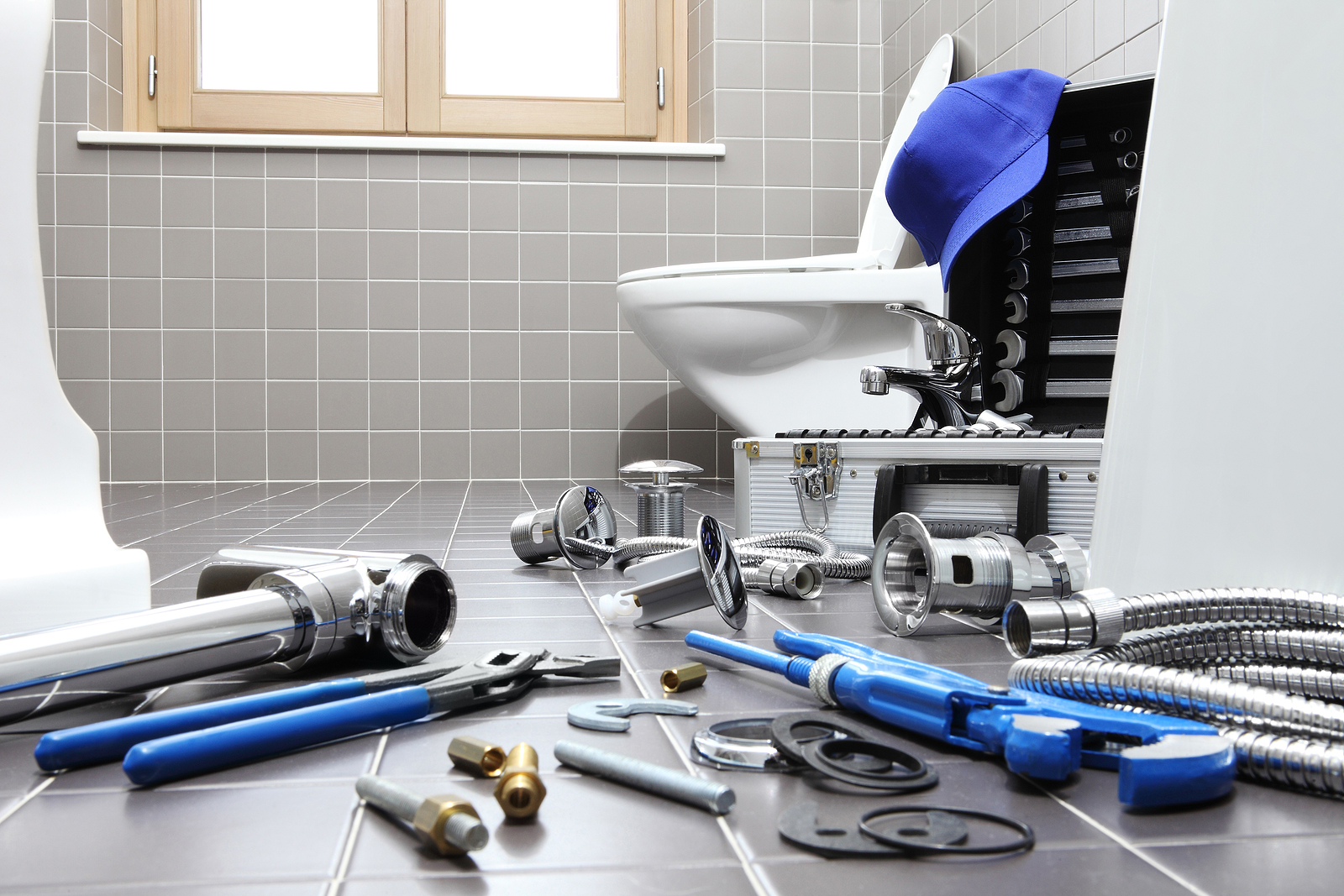 Plumber Tools And Equipment In A Bathroom, Plumbing Repair Servi